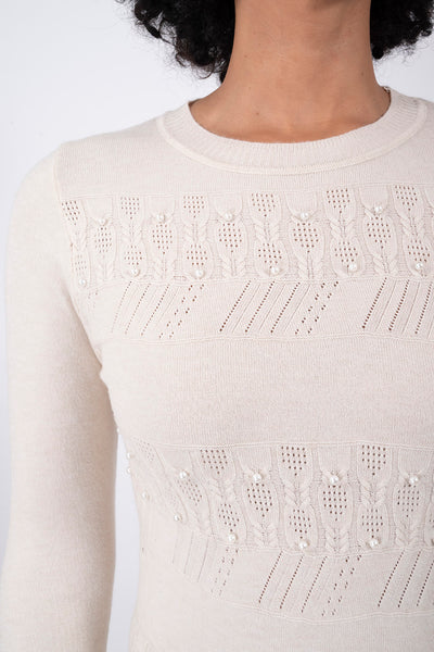 Suéter Elegante con Detalles Beige – detalle de la prenda