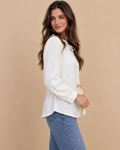 Blusa Lazo Borlas Doradas Blanco – lateral