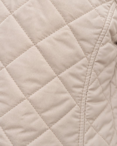 Chamarra Acolchada con Capucha Beige – detalle de tela